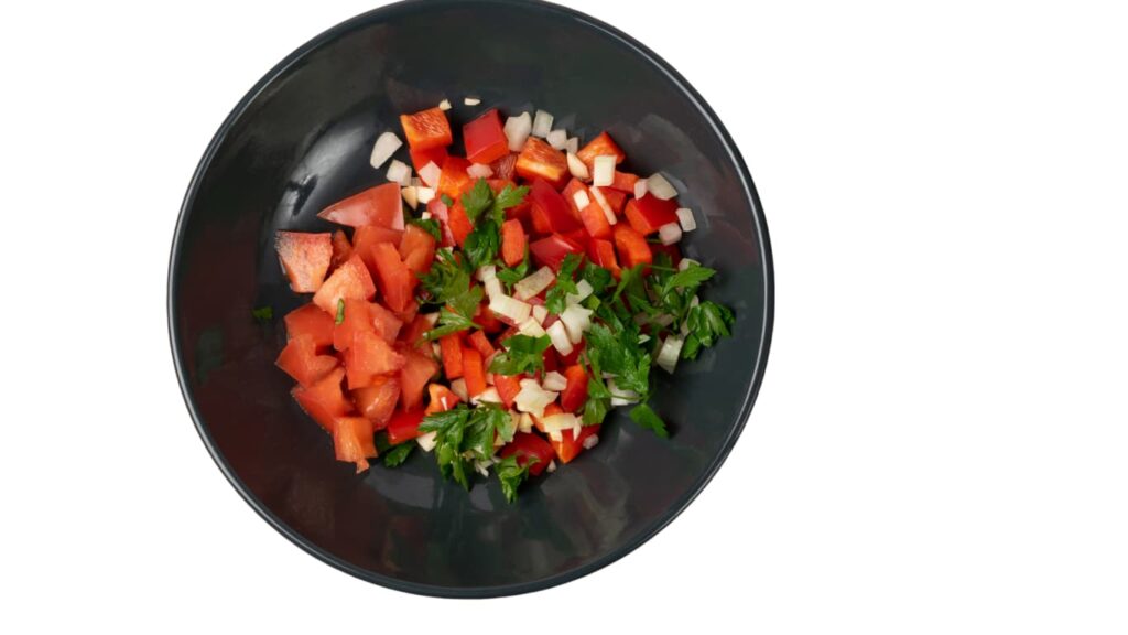 Mediterranean chopped salad with cucumbers, tomatoes, red onions, olives, and feta cheese tossed in lemon-herb dressing.